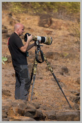 daniele occhiato standing with his camera